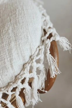 BLOOMINGVILLE ROUND COTTON PILLOW WITH TASSELS
