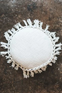 BLOOMINGVILLE ROUND COTTON PILLOW WITH TASSELS