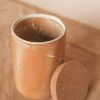 CREATIVE CO OP STONEWARE CANISTER W/ CORK LID · 8.25"