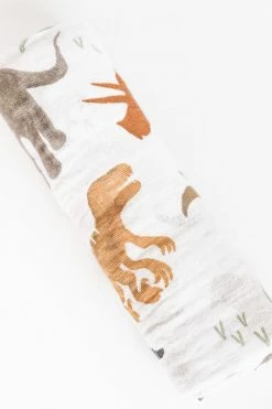 LITTLE UNICORN Baby + Kids COTTON MUSLIN SWADDLE · DINO FRIENDS