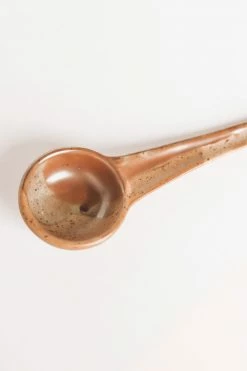 CREATIVE CO OP TWO-TONE STONEWARE SERVING SPOON