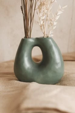 CREATIVE CO OP ABSTRACT TERRA COTTA VASE W/ TWO OPENINGS