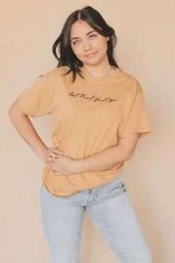 HumanKIND Company LET THAT SHIT GO · SCRIPT EMBROIDERED TEE Tops