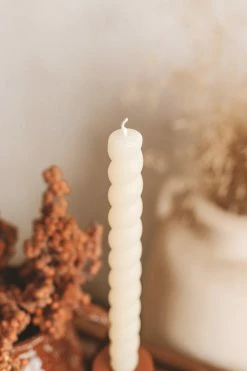 CREATIVE CO OP UNSCENTED TWISTED TAPER CANDLES · CREAM