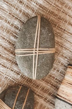 CREATIVE CO OP RATTAN-WRAPPED RIVER STONE DECOR