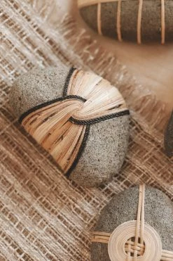 CREATIVE CO OP RATTAN-WRAPPED RIVER STONE DECOR