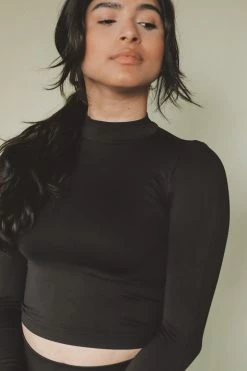 NIKIBIKI MOCK NECK CROP TOP Tops