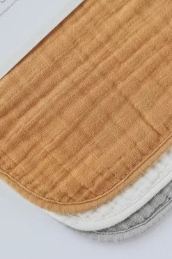 LITTLE UNICORN COTTON MUSLIN BIB 3-PACK · MUSTARD