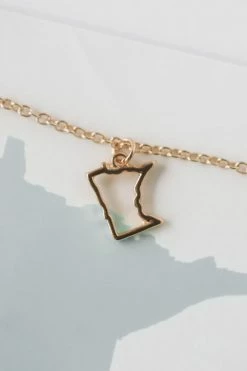 LUCKY FEATHER MINNESOTA NECKLACE · 14k GOLD LIFESTYLE