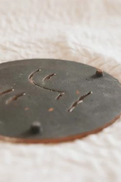 BLOOMINGVILLE DEBOSSED SUN CAST IRON TRIVET Home