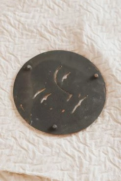 BLOOMINGVILLE DEBOSSED SUN CAST IRON TRIVET Home