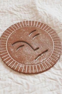 BLOOMINGVILLE DEBOSSED SUN CAST IRON TRIVET Home