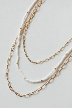 THE LUCKY COLLECTIVE WHITE BEAD + GOLD METAL LAYERED NECKLACE ACCESSORIES