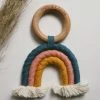 CHEWABLE CHARM RAINBOW MACRAME TEETHER · TEAL + ROSE