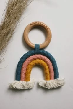 CHEWABLE CHARM RAINBOW MACRAME TEETHER · TEAL + ROSE