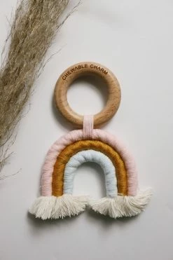 CHEWABLE CHARM LIFESTYLE RAINBOW MACRAME TEETHER · PINK + BLUE